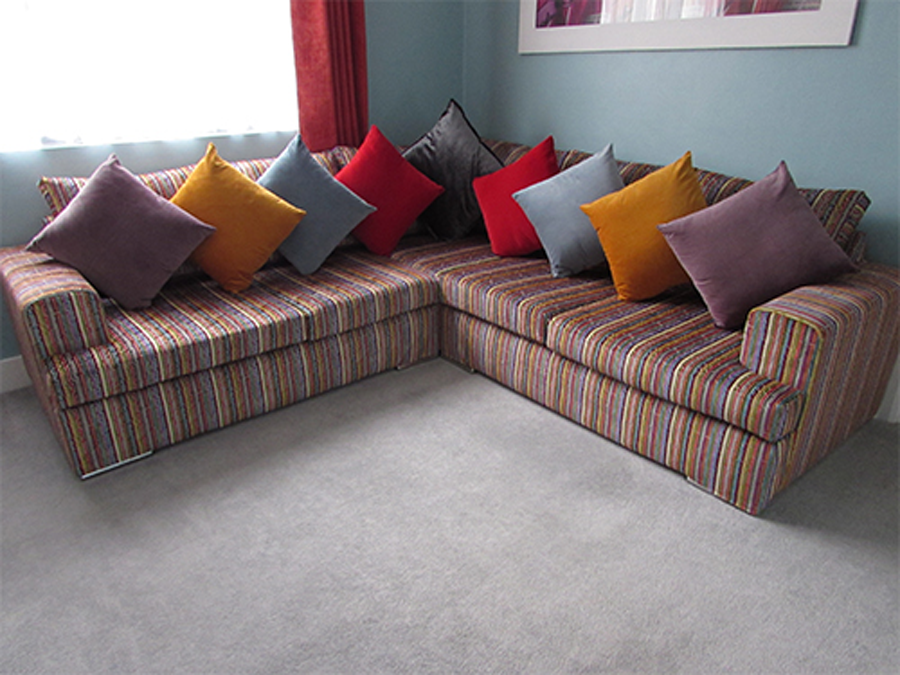 Kellie Hodge Corner Sofas In A Bright Amazilia JO-231 Velvet Fabric