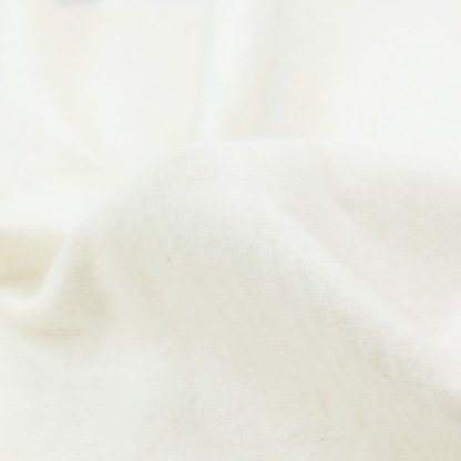 A white Crib 5 barrier felt showing a smooth, dense fabric surface.