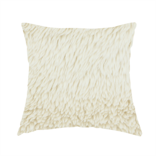 The fabric used to create this handmade cushion is a cream or off-white, high-pile faux fur fabric. The texture appears soft, fluffy, and dense, characterized by long, slightly tousled fibres that give it a cosy, shag-like appearance.