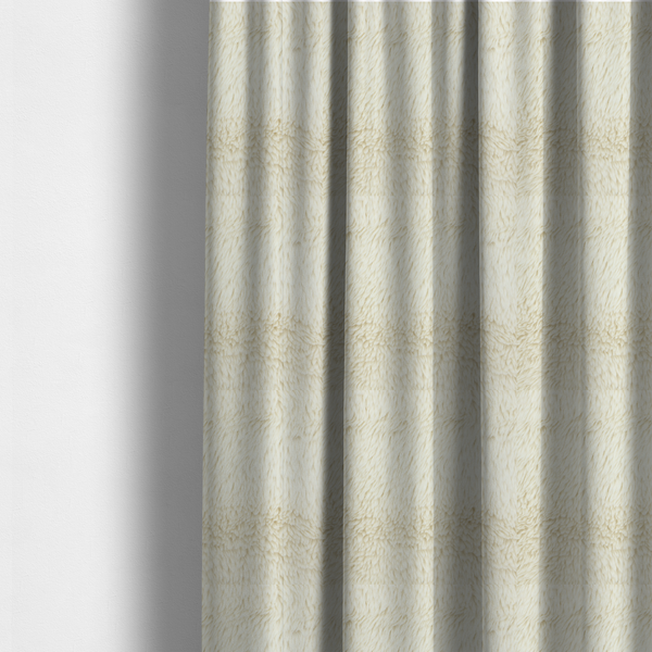 The fabric used to create these made-to-measure curtains is a cream or off-white, high-pile faux fur fabric. The texture appears soft, fluffy, and dense, characterized by long, slightly tousled fibres that give it a cosy, shag-like appearance.