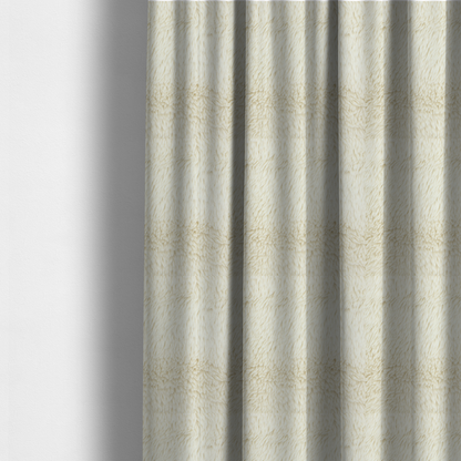 The fabric used to create these made-to-measure curtains is a cream or off-white, high-pile faux fur fabric. The texture appears soft, fluffy, and dense, characterized by long, slightly tousled fibres that give it a cosy, shag-like appearance.