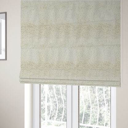 The fabric used to create these Roman blinds is a cream or off-white, high-pile faux fur fabric. The texture appears soft, fluffy, and dense, characterized by long, slightly tousled fibres that give it a cosy, shag-like appearance.