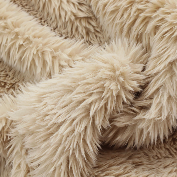 A tan or light beige, high-pile faux fur fabric. It has a dense, plush, and cosy texture with soft, slightly tousled fibres that create a shag-like appearance.
