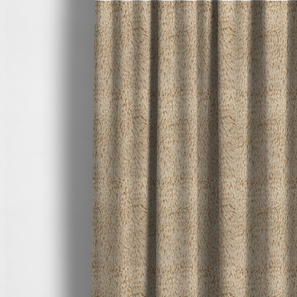 The fabric used to create these made-to-measure curtains is a tan or light beige, high-pile faux fur fabric. It has a dense, plush, and cosy texture with soft, slightly tousled fibres that create a shag-like appearance.