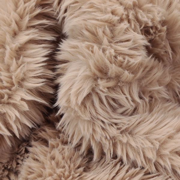 A warm beige or sandy-toned, high-pile faux fur fabric. It displays a dense, luxurious texture with soft, tousled fibres that create a cosy, shag-inspired look.
