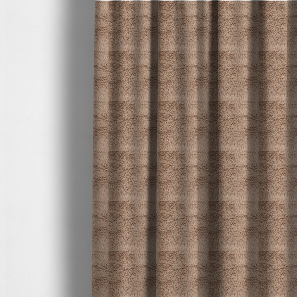 The fabric used to create these made-to-measure curtains is a warm beige or sandy-toned, high-pile faux fur fabric. It displays a dense, luxurious texture with soft, tousled fibres that create a cosy, shag-inspired look.
