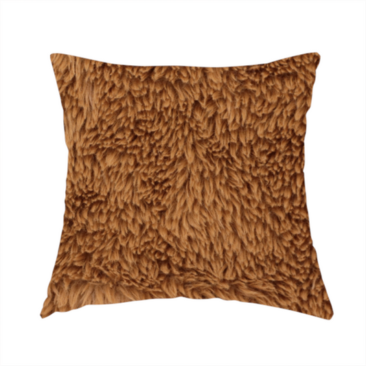 The fabric used to create this handmade cushion is a rich, warm brown, high-pile faux fur fabric. It features a dense, luxurious texture with soft, tousled fibres that create a cosy, shag-like appearance.