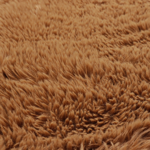 A rich, warm brown, high-pile faux fur fabric. It features a dense, luxurious texture with soft, tousled fibres that create a cosy, shag-like appearance.