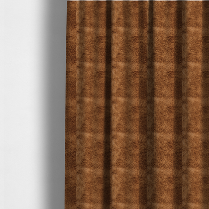 The fabric used to create these made-to-measure curtains is a rich, warm brown, high-pile faux fur fabric. It features a dense, luxurious texture with soft, tousled fibres that create a cosy, shag-like appearance.