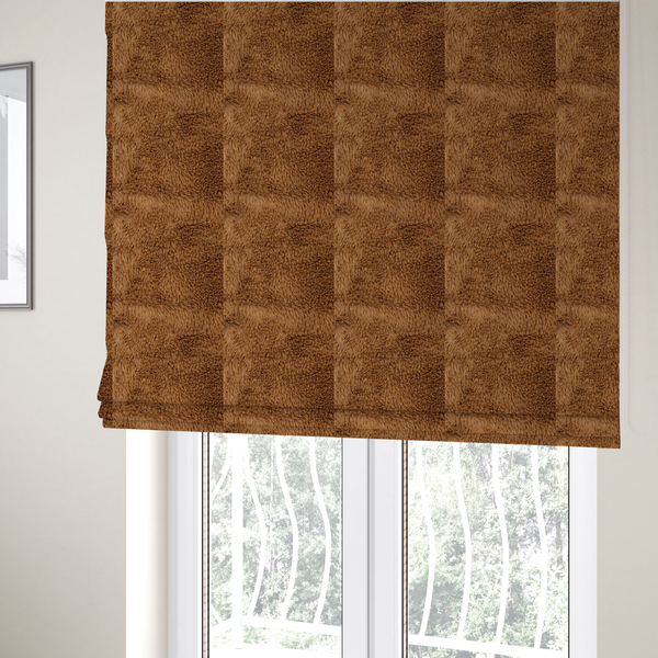 The fabric used to create these Roman blinds is a rich, warm brown, high-pile faux fur fabric. It features a dense, luxurious texture with soft, tousled fibres that create a cosy, shag-like appearance.