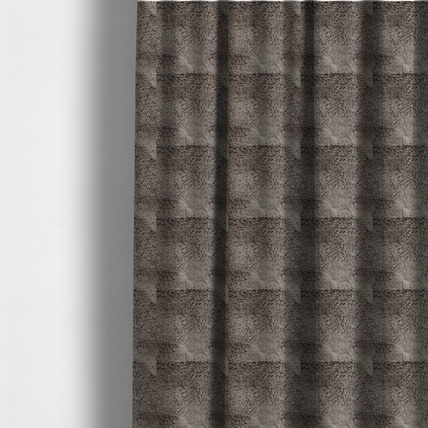 The fabric used to create these made-to-measure curtains is a cool-toned, greyish-brown or charcoal-taupe, high-pile faux fur fabric. It displays a dense, luxurious texture with soft, tousled fibres that create a cosy, shag-inspired look.