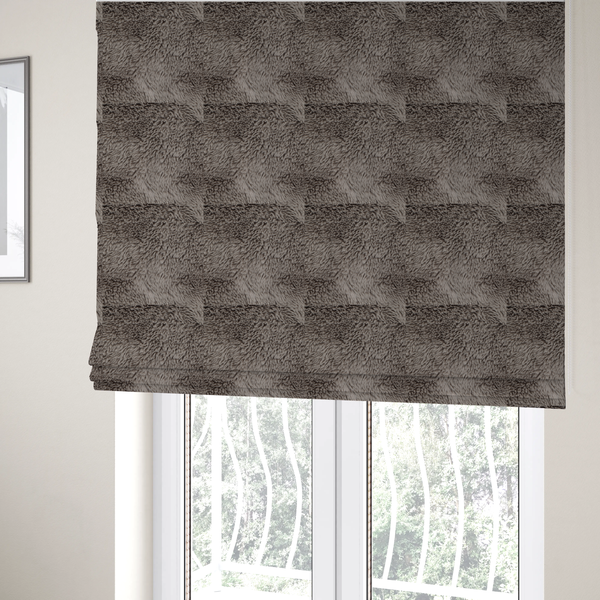The fabric used to create these Roman blinds is a cool-toned, greyish-brown or charcoal-taupe, high-pile faux fur fabric. It displays a dense, luxurious texture with soft, tousled fibres that create a cosy, shag-inspired look.