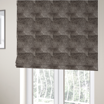 The fabric used to create these Roman blinds is a cool-toned, greyish-brown or charcoal-taupe, high-pile faux fur fabric. It displays a dense, luxurious texture with soft, tousled fibres that create a cosy, shag-inspired look.