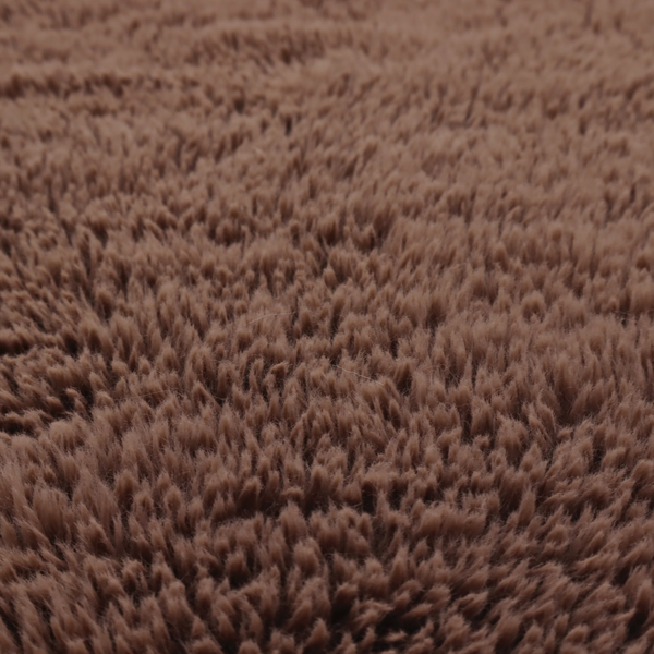 A deep, rich chocolate brown, high-pile faux fur fabric. It has a dense, luxurious texture with soft, tousled fibres that give it a warm and cosy shag-like appearance.