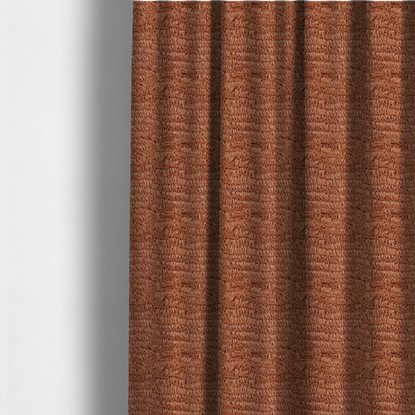 The fabric used to create these made-to-measure curtains is a rust or burnt-orange, high-pile faux fur fabric. It features a unique, wavy or rippled texture created by the directional alignment of the plush, soft fibres, giving it a distinctive shag-like appearance.