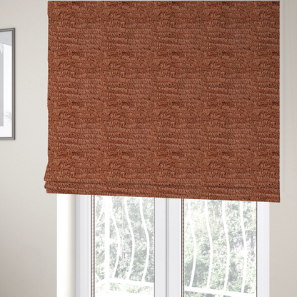 The fabric used to create these Roman blinds is a rust or burnt-orange, high-pile faux fur fabric. It features a unique, wavy or rippled texture created by the directional alignment of the plush, soft fibres, giving it a distinctive shag-like appearance.