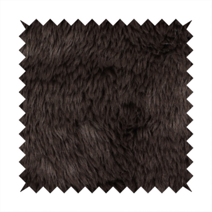 A deep, dark espresso or near-black, high-pile faux fur fabric. It displays a dense, luxurious texture with soft, slightly tousled fibres that create a cosy, sophisticated shag-like appearance.