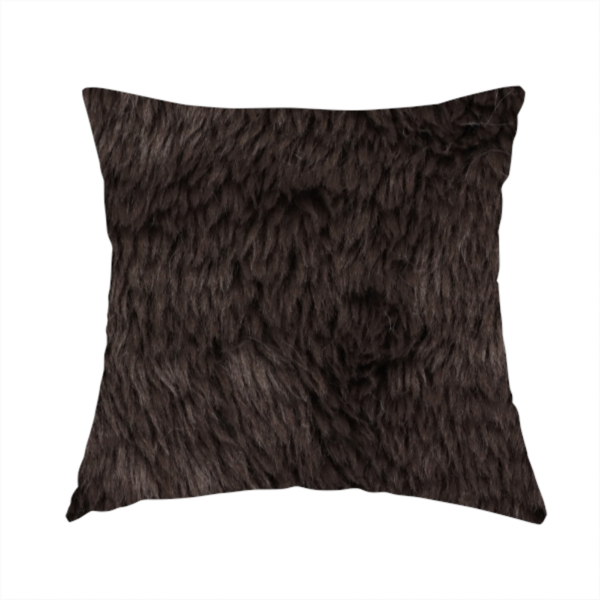 The fabric used to create this handmade cushions is a deep, dark espresso or near-black, high-pile faux fur fabric. It displays a dense, luxurious texture with soft, slightly tousled fibres that create a cosy, sophisticated shag-like appearance.