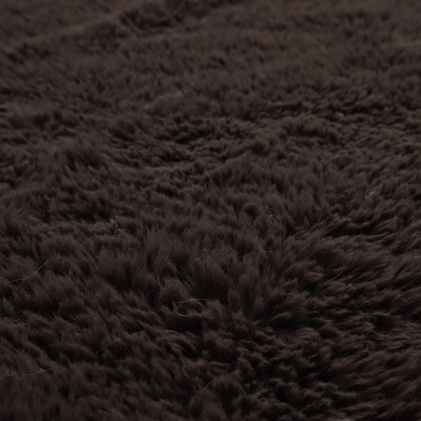 A deep, dark espresso or near-black, high-pile faux fur fabric. It displays a dense, luxurious texture with soft, slightly tousled fibres that create a cosy, sophisticated shag-like appearance.