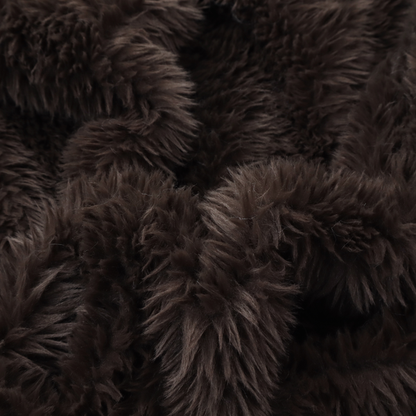 A deep, dark espresso or near-black, high-pile faux fur fabric. It displays a dense, luxurious texture with soft, slightly tousled fibres that create a cosy, sophisticated shag-like appearance.
