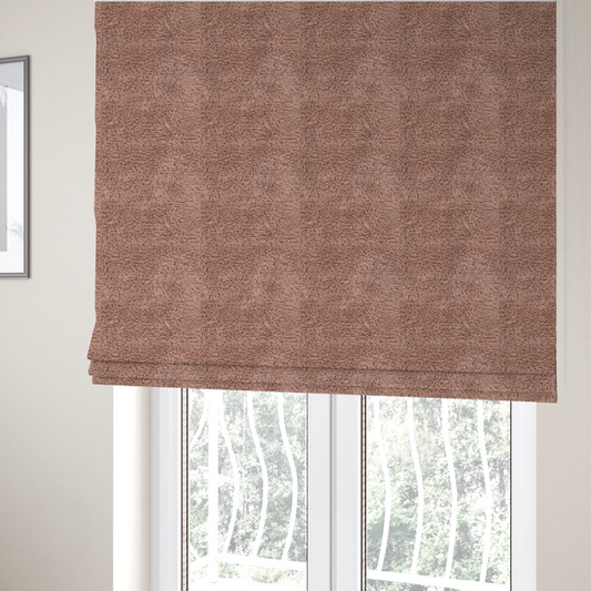 The fabric used to create these Roman blinds is a dusty rose or soft mauve, high-pile faux fur fabric. It features a dense, luxurious texture with soft, tousled fibres that create a cosy, shag-like appearance.