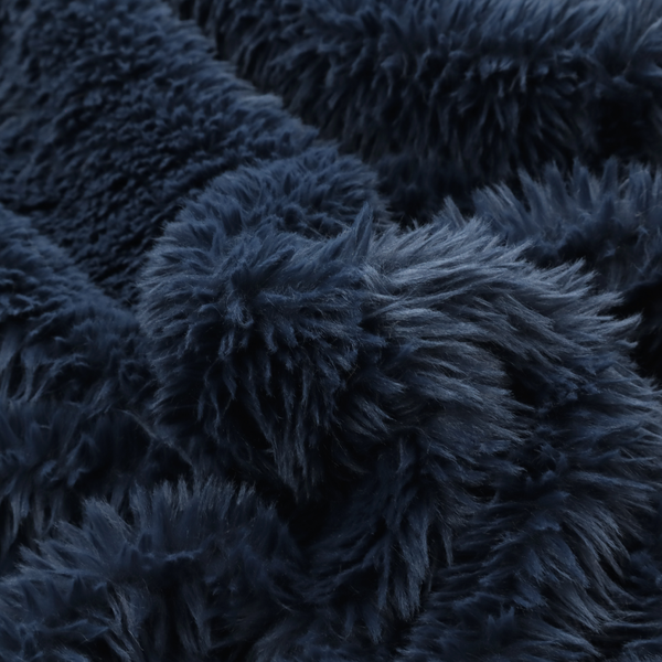A deep navy blue, high-pile faux fur fabric. It displays a dense, luxurious texture with soft, slightly tousled fibres that create a cosy and sophisticated shag-like appearance.