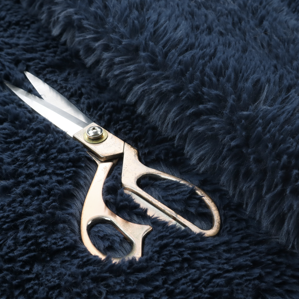 A deep navy blue, high-pile faux fur fabric. It displays a dense, luxurious texture with soft, slightly tousled fibres that create a cosy and sophisticated shag-like appearance.