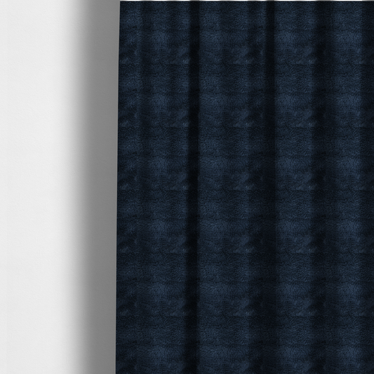 The fabric used to create these made-to-measure curtains is a deep navy blue, high-pile faux fur fabric. It displays a dense, luxurious texture with soft, slightly tousled fibres that create a cosy and sophisticated shag-like appearance.