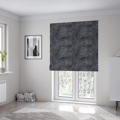 The fabric used to create these Roman blinds is a dark charcoal-grey, high-pile faux fur fabric. It displays a dense, luxurious texture with soft, slightly tousled fibres that create a cosy and sophisticated shag-like appearance.