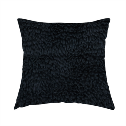 The fabric used to create this handmade cushion is a solid black, high-pile faux fur fabric. It displays a dense, luxurious texture with soft, tousled fibres that create a cosy, sophisticated, and uniform shag-like appearance.