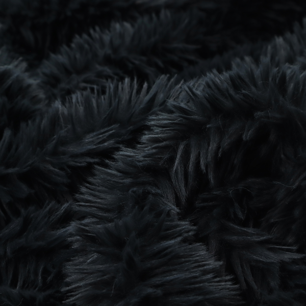 a solid black, high-pile faux fur fabric. It displays a dense, luxurious texture with soft, tousled fibres that create a cosy, sophisticated, and uniform shag-like appearance.