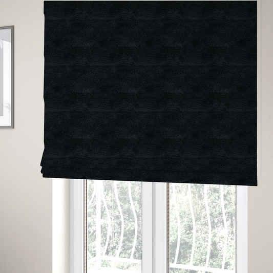 The fabric used to create these Roman blinds is a solid black, high-pile faux fur fabric. It displays a dense, luxurious texture with soft, tousled fibres that create a cosy, sophisticated, and uniform shag-like appearance.