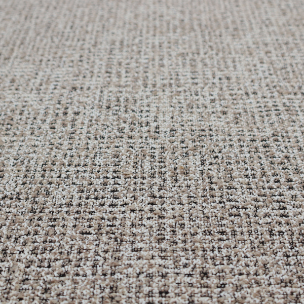 A textured, woven fabric featuring a complex pattern of beige, black, and white threads, creating a speckled and mottled appearance.