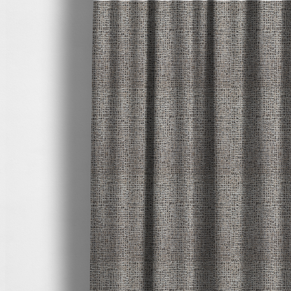 The fabric used to create these made-to-measure curtains is a textured, woven fabric featuring a complex pattern of beige, black, and white threads, creating a speckled and mottled appearance.
