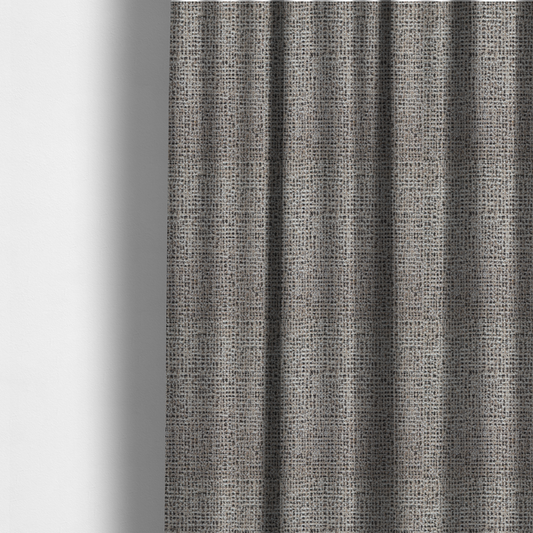 The fabric used to create these made-to-measure curtains is a textured, woven fabric featuring a complex pattern of beige, black, and white threads, creating a speckled and mottled appearance.