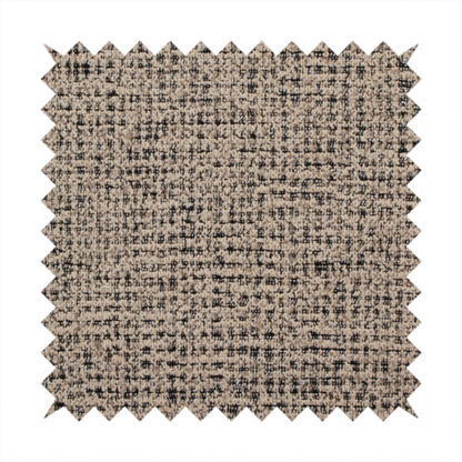 A textured, woven fabric featuring a complex pattern of beige, black, and white threads, creating a speckled and mottled appearance.