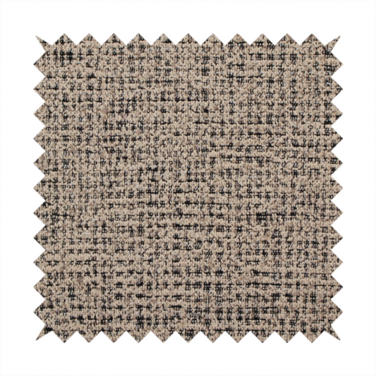 A textured, woven fabric featuring a complex pattern of beige, black, and white threads, creating a speckled and mottled appearance.