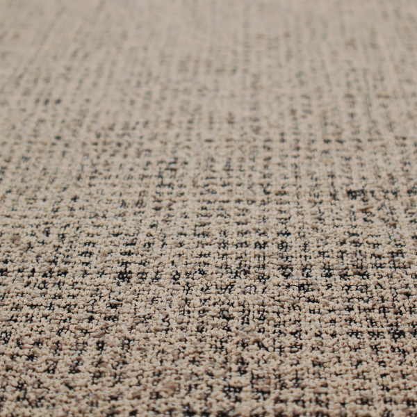 A textured, woven fabric featuring a complex pattern of beige, black, and white threads, creating a speckled and mottled appearance.