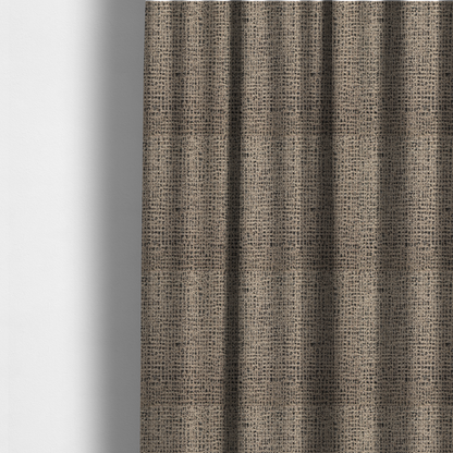 The fabric used to create these made-to-measure curtains is a textured, woven fabric featuring a complex pattern of beige, black, and white threads, creating a speckled and mottled appearance.