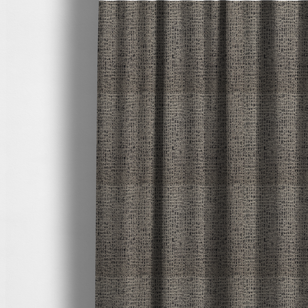 The fabric used to create these made-to-measure curtains is a textured, woven fabric featuring a complex pattern of beige, black, and white threads, creating a speckled and mottled appearance.
