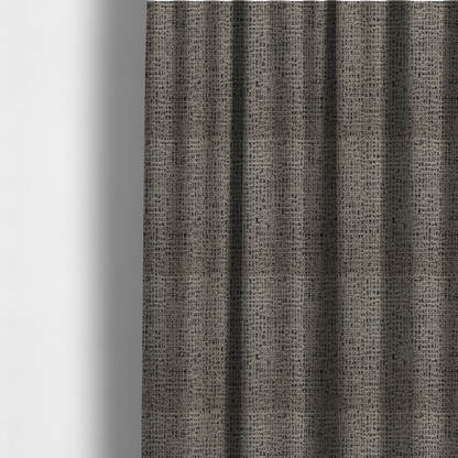 The fabric used to create these made-to-measure curtains is a textured, woven fabric featuring a complex pattern of beige, black, and white threads, creating a speckled and mottled appearance.
