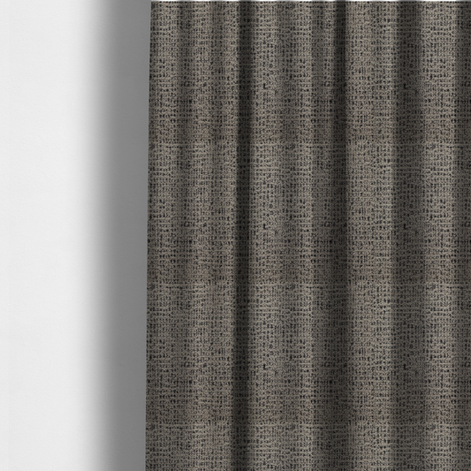 The fabric used to create these made-to-measure curtains is a textured, woven fabric featuring a complex pattern of beige, black, and white threads, creating a speckled and mottled appearance.