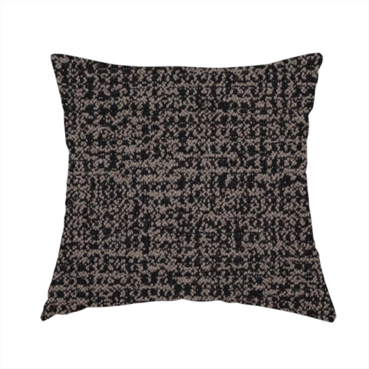 The fabric used to create this handmade cushion is a textured, woven fabric featuring a complex pattern of dark brown, black, and beige threads, creating a speckled and mottled appearance.