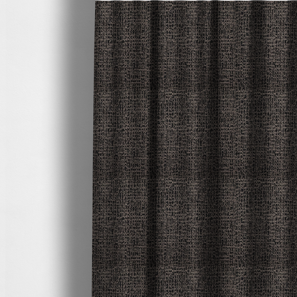 The fabric used to create these made-to-measure curtains is a textured, woven fabric featuring a complex pattern of dark brown, black, and beige threads, creating a speckled and mottled appearance.