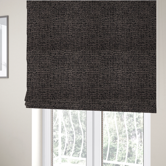 The fabric used to create these Roman blinds is a textured, woven fabric featuring a complex pattern of dark brown, black, and beige threads, creating a speckled and mottled appearance.