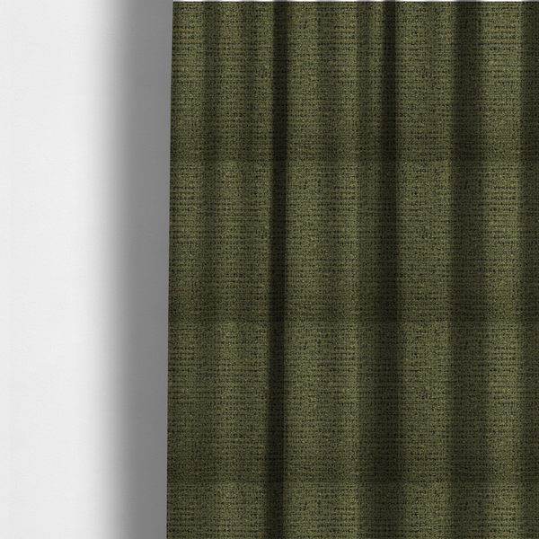 the fabric used to create these made-to-measure curtains is a textured, woven fabric featuring a complex pattern of green, dark, and beige threads, creating a speckled and mottled appearance.