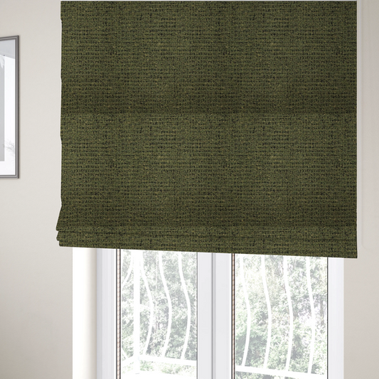 The fabric used to create these Roman blinds is a textured, woven fabric featuring a complex pattern of green, dark, and beige threads, creating a speckled and mottled appearance.