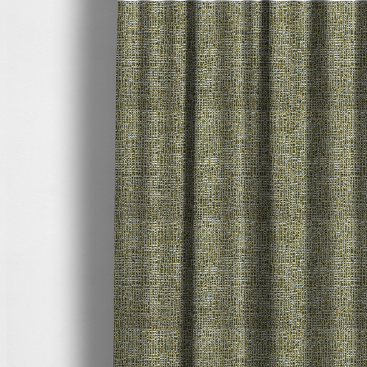 The fabric used to create these made-to-measure curtains is a textured, woven fabric featuring a complex pattern of green, dark, and white threads, creating a speckled and mottled appearance.