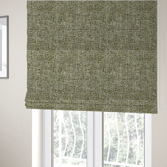 The fabric used to create these Roman blinds is a textured, woven fabric featuring a complex pattern of green, dark, and white threads, creating a speckled and mottled appearance.