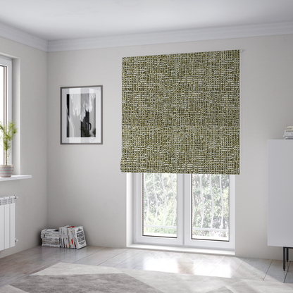 The fabric used to create these Roman blinds is a textured, woven fabric featuring a complex pattern of green, dark, and white threads, creating a speckled and mottled appearance.